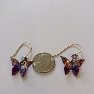 Holly Yashi earrings. Beautiful colors purple green with a stone on the hoops.